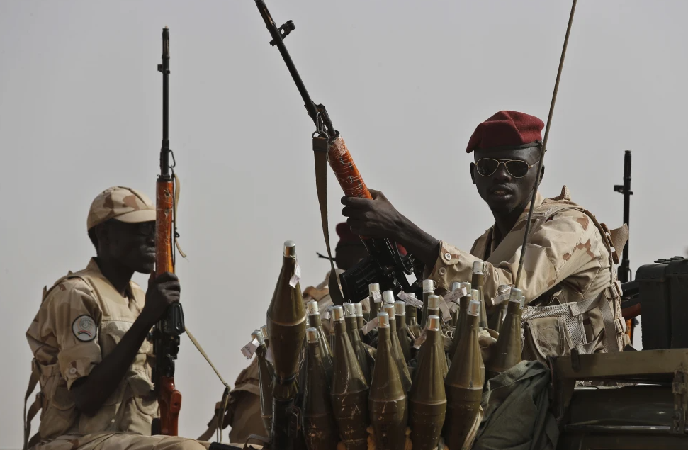 Sudanese soldiers from the Rapid Support Forces unit, led by Gen. Mohammed Hamdan Dagalo, the deputy head of the military council, secure the area where Dagalo attends a military-backed tribe’s rally, in the East Nile province, Sudan, on June 22, 2019.