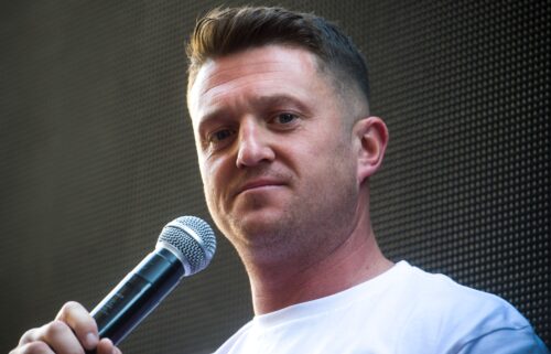 British far-right activist Tommy Robinson (real name Stephen Yaxley-Lennon) is shown speaking to supporters in London in 2021. Robinson has been jailed for 18 months after he admitted to being in contempt of court by repeating false accusations about a Syrian refugee