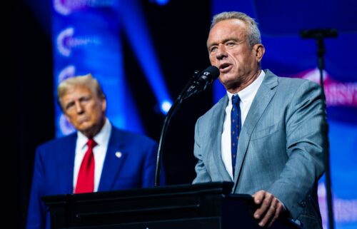 Robert F. Kennedy Jr. speaks with Republican presidential nominee former President Donald Trump at a Turning Point Action Rally in Duluth