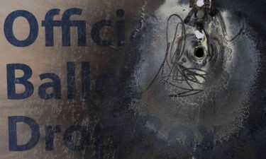 A damaged ballot drop box is displayed during a news conference at the Multnomah County Elections Division office on October 28 in Portland