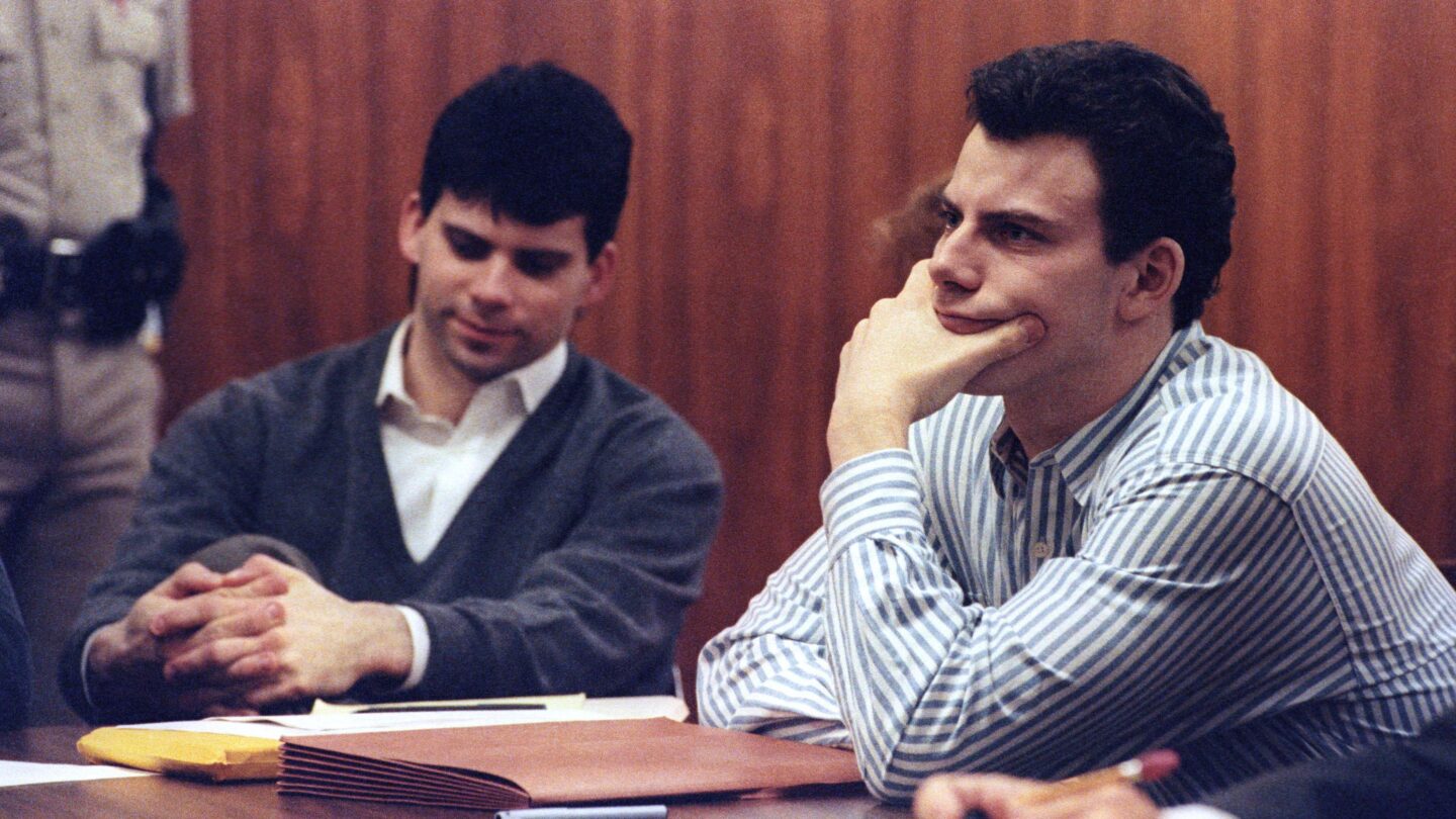 Lyle Menendez, left, and his brother, Eric, listen to court proceedings during their first trial in 1991.