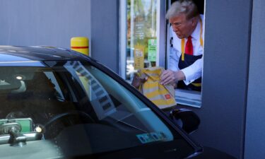 Former President Donald Trump serves food at a McDonalds restaurant in Pennsylvania.