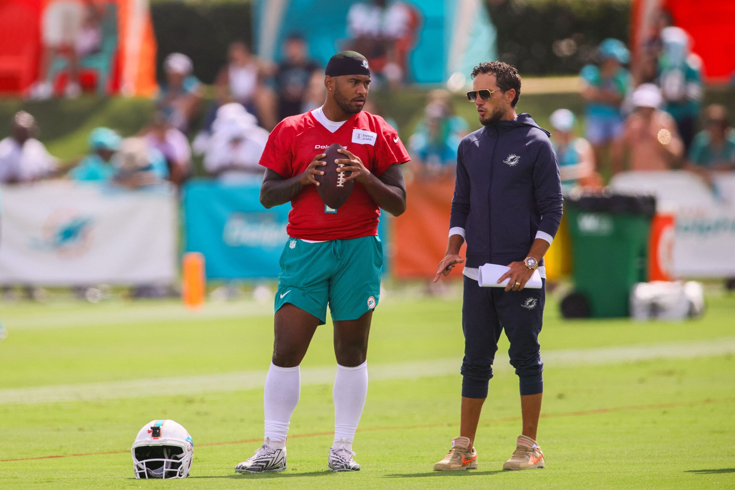 <i>Sam Navarro/USA Today Sports/Reuters via CNN Newsource</i><br/>Miami Dolphins quarterback Tua Tagovailoa and head coach Mike McDaniel talk during training camp.