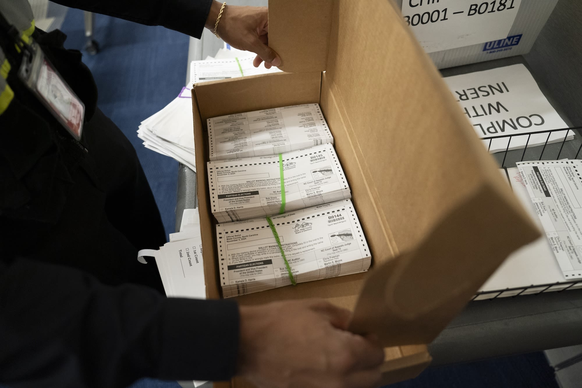 Absentee ballots are prepared to be mailed at the Wake County Board of Elections on September 17, 2024, in Raleigh, North Carolina.