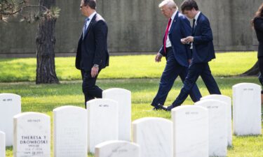 Former President Donald Trump leaves Section 60 of Arlington National Cemetery after he attended a ceremony honoring the lives of those who died at the Abbey Gate Bombing