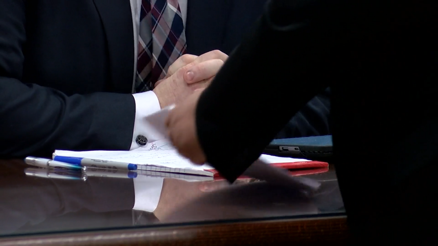 Lawyers discuss during a hearing in the state's Walmart shooting case