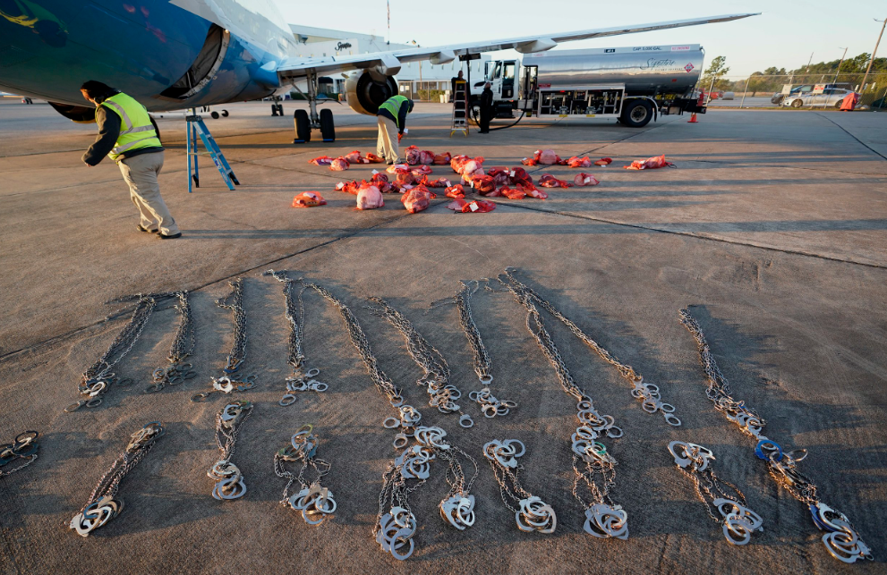 Items belonging to immigrants who entered the United States illegally are loaded onto a plane for a deportation flight to El Salvador by U.S. Immigration and Customs Enforcement in Houston on November 16, 2018.