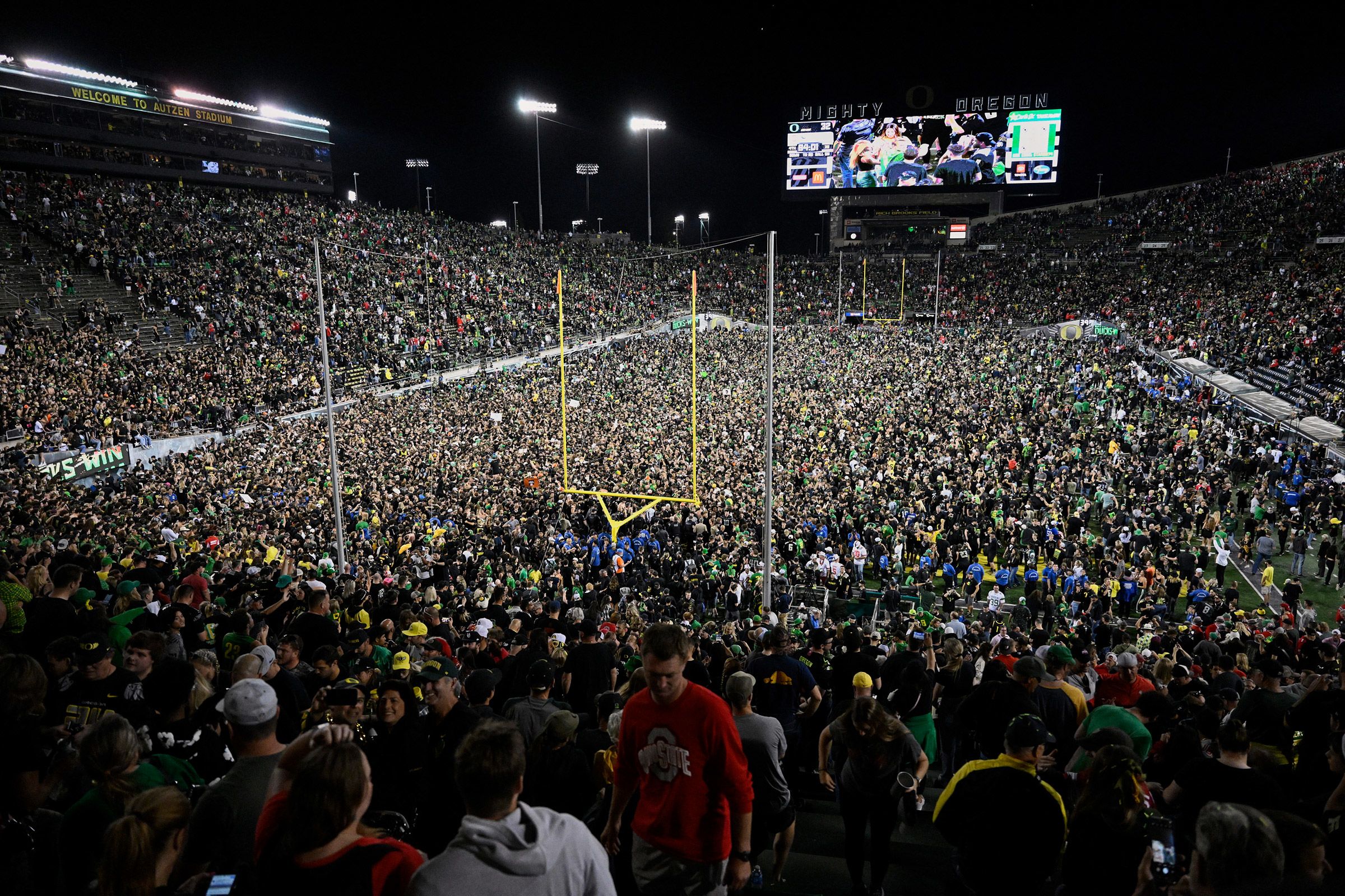 <i>Troy Wayrynen/USA Today Sports/Reuters via CNN Newsource</i><br/>Ducks fans rush the field after Oregon beat the Ohio State Buckeyes in Eugene