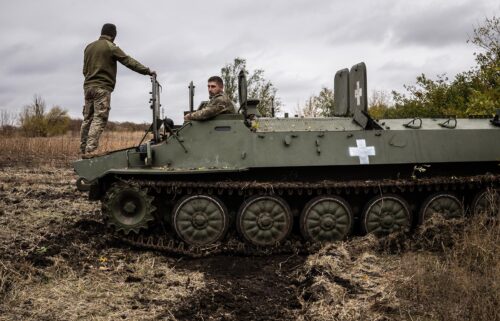 Two Ukrainian army mechanics repair a broken MT-LB (light armored multi-purpose towing vehicle) in the Donetsk region in Kharkiv