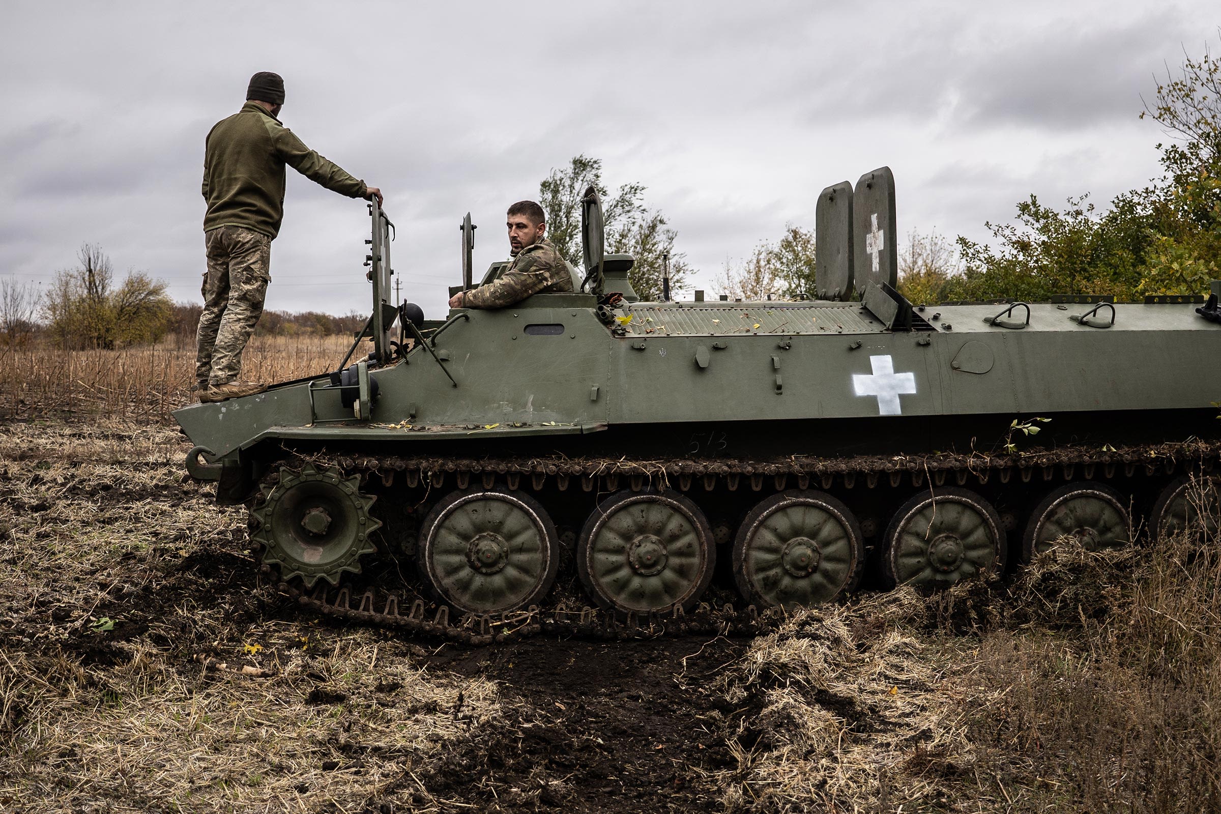 <i>Fermin Torrano/Anadolu/Getty Images via CNN Newsource</i><br/>Two Ukrainian army mechanics repair a broken MT-LB (light armored multi-purpose towing vehicle) in the Donetsk region in Kharkiv