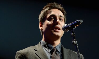 Iranian activist Kianoosh Sanjari speaks on stage at the Amnesty International Concert presented by the CBGB Festival at Barclays Center in New York City