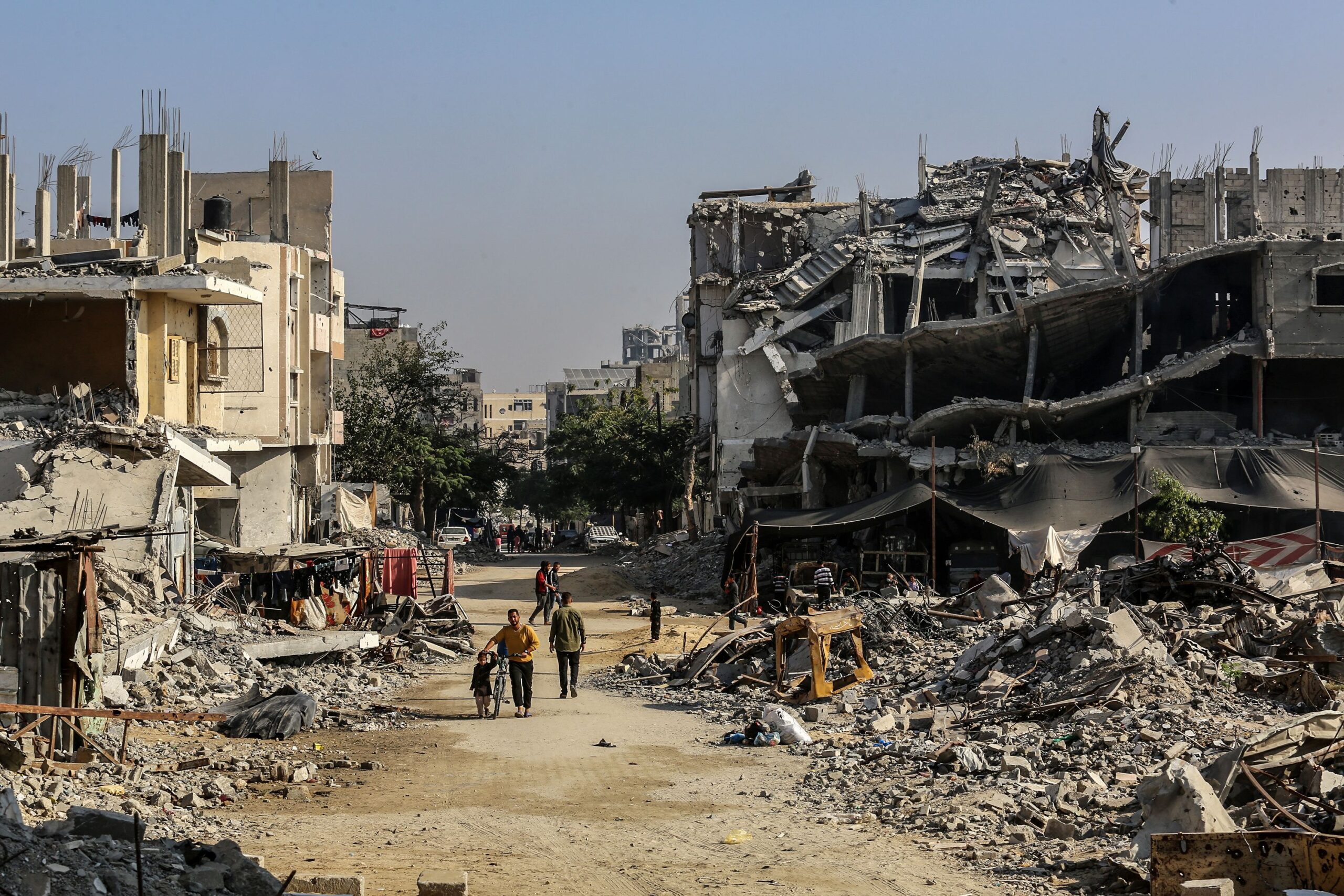 <i>Abed Rahim Khatib/Anadolu/Getty Images via CNN Newsource</i><br/>Palestinians are seen among the rubbles of demolished house as Palestinians try to continue their daily lives despite the destroyed buildings and difficult conditions in Khan Yunis