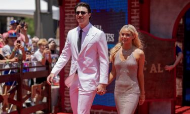 Paul Skenes and Livvy Dunne pose for a photo during the 2024 All-Star Red Carpet Show in Arlington