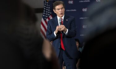 Mehmet Oz speaks during a town hall in Bell Blue