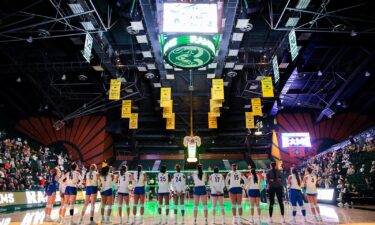 Workers monitor a women's volleyball game between San Jose State and Colorado State in Fort Collins