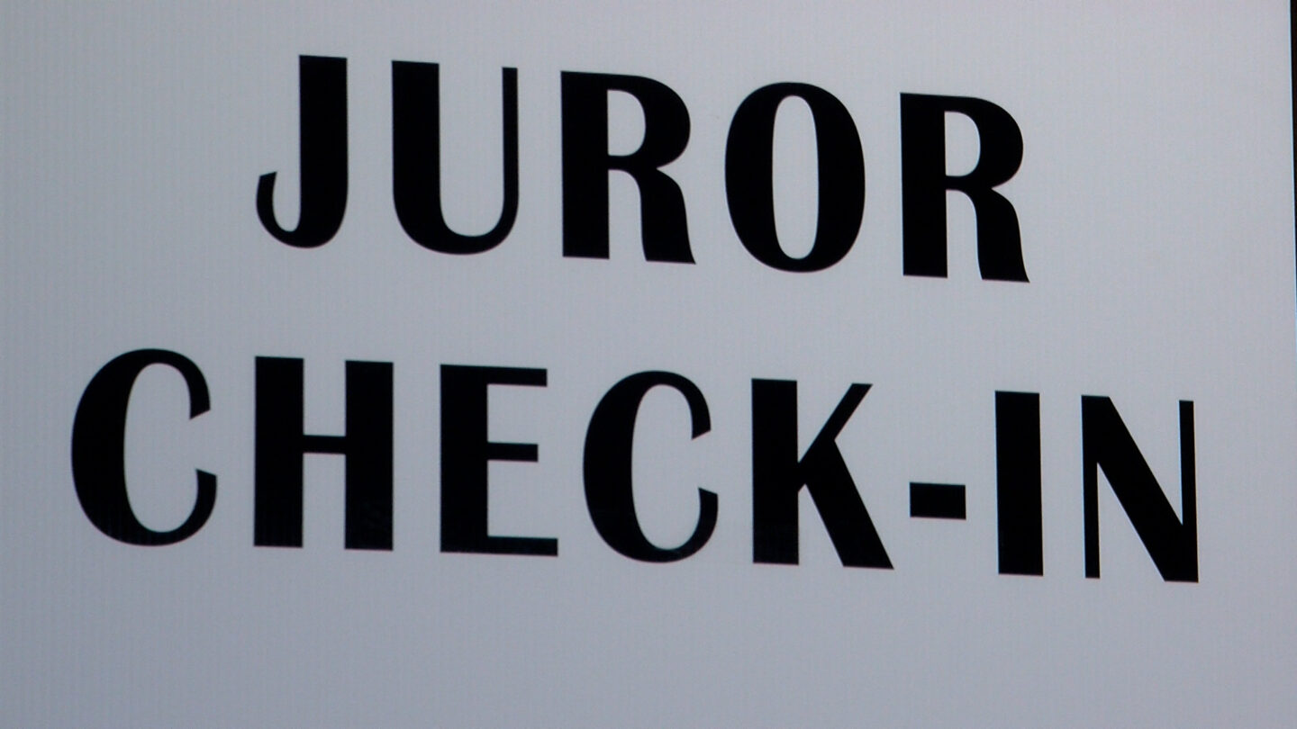 Juror check-in sign inside Liberty Hall in Downtown El Paso 