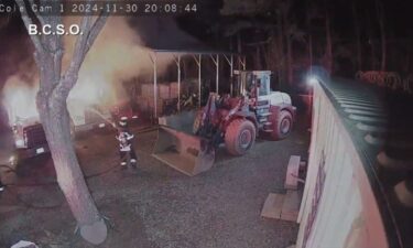 New surveillance video has been released by the Buncombe County Sheriff’s Office as deputies search for a suspect after two commercial trucks were set on fire at a Weaverville business the night of Saturday