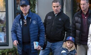 President Joe Biden and his son Hunter Biden walk in downtown Nantucket