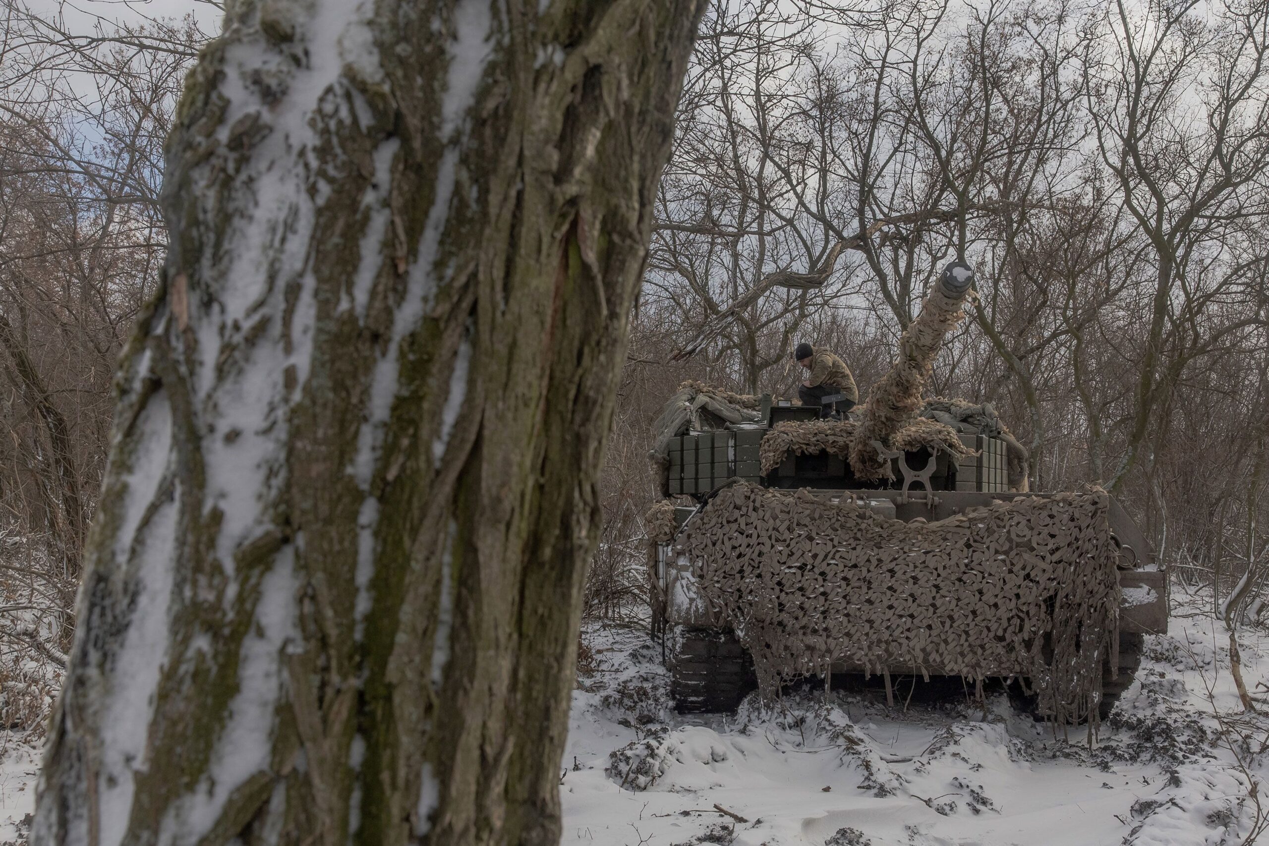 <i>Roman Pilipey/AFP/Getty Images via CNN Newsource</i><br/>A Ukrainian crew member stands on a Leopard 1A5 tank near Pokrovsk in Ukraine's eastern Donetsk region on December 13.