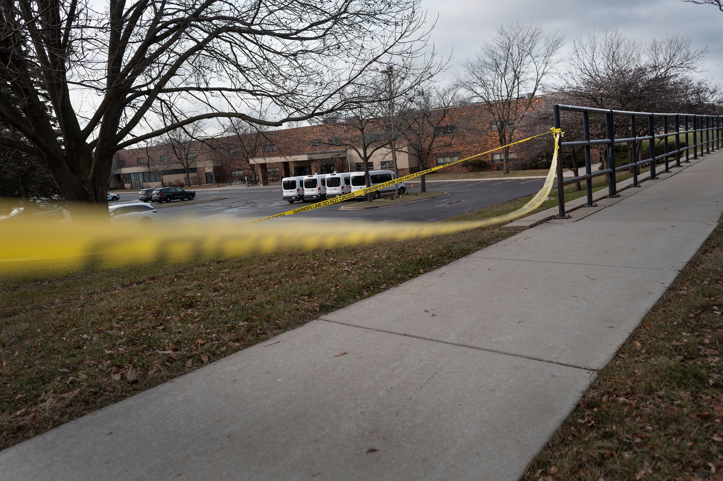 <i>Scott Olson/Getty Images via CNN Newsource</i><br/>Crime scene tape is stretched around Abundant Life Christian School in Madison