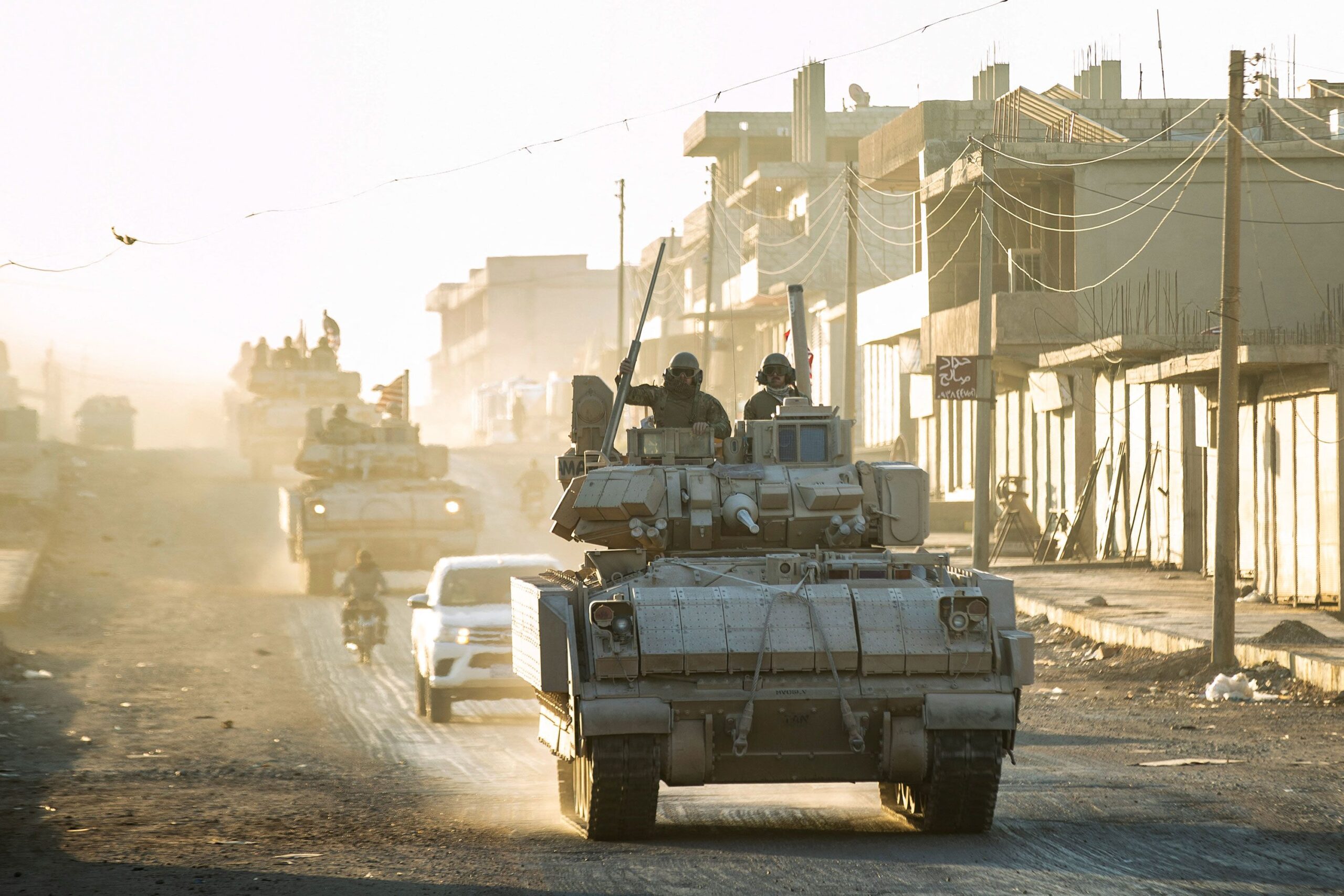 <i>Delil Souleiman/AFP/Getty Images via CNN Newsource</i><br/>US forces patrol oil fields near Syria's northeastern border with Turkey in the Qahtaniyah countryside in the far northeast corner of Hasakeh province on September 3.