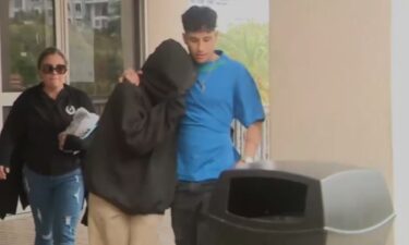 An 18-year-old woman accused of making threats to her school walked out of jail after spending two days in jail.