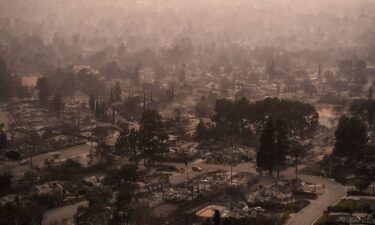 Smoke lingers over a neighborhood devastated by the Eaton Fire