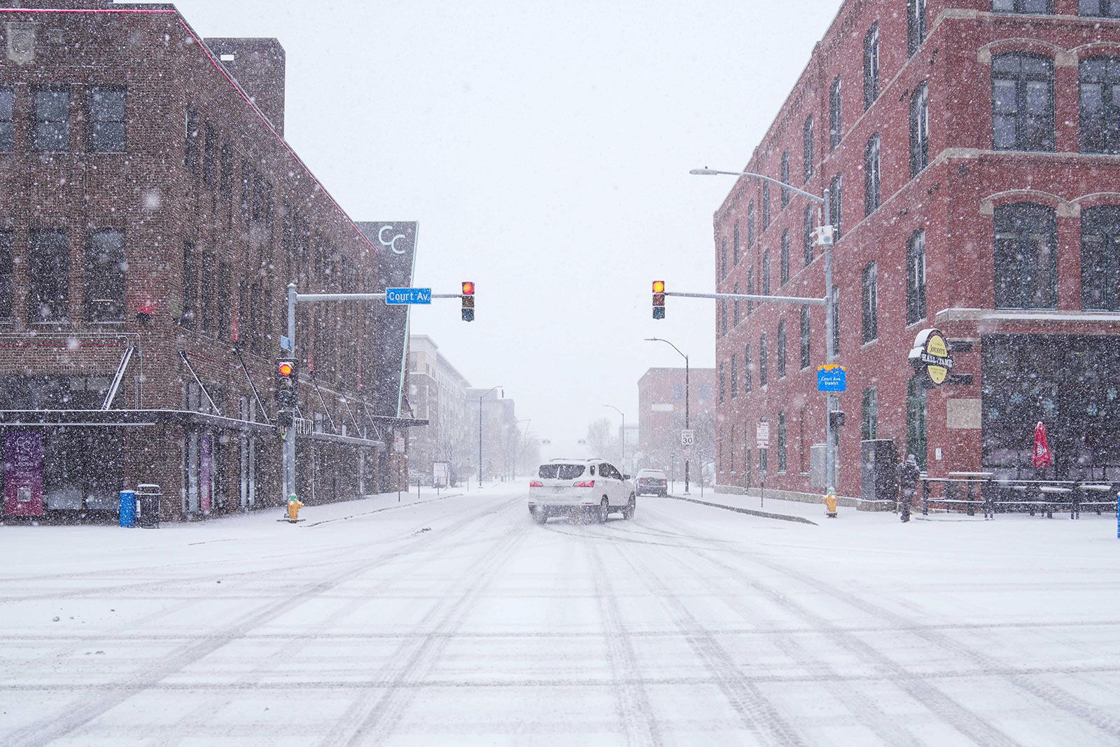 <i>Cody Scanlan/The Register/USA Today Network/Imagn Images via CNN Newsource</i><br/>A car slides around a corner amid snow in Des Moines