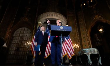 President-elect Donald Trump speaks as House Speaker Mike Johnson listens during a news conference at Mar-a-Lago in Palm Beach