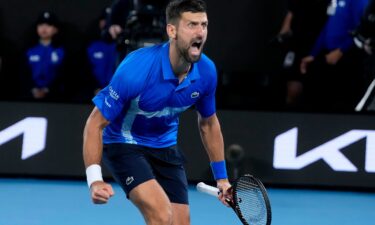 Novak Djokovic celebrates after defeating Carlos Alcaraz at the Australian Open.