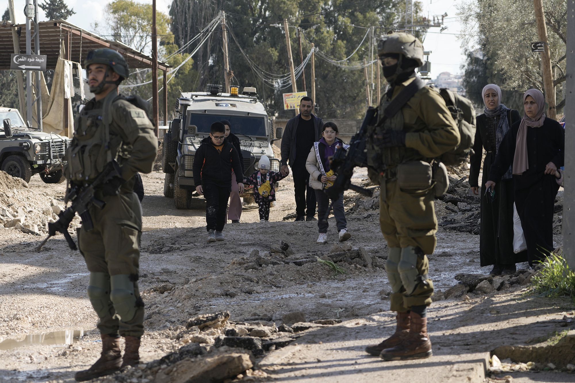 <i>Zain Jaafar/AFP/Getty Images via CNN Newsource</i><br/>Commuters wait in their vehicles at the Israeli Atara checkpoint on route 465 near Ramallah in the occupied West Bank on January 22.
