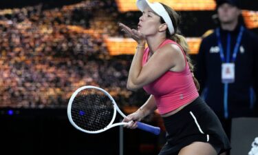 Danielle Collins cups her ear to the crowd after being booed.
