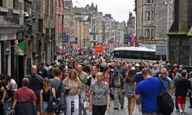 Crowds of festivalgoers and tourists throng the approaches to Edinburgh Castle during the Edinburgh Festival Fringe on August 10