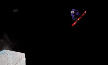 Hiroto Ogiwara celebrates after landing his trick.