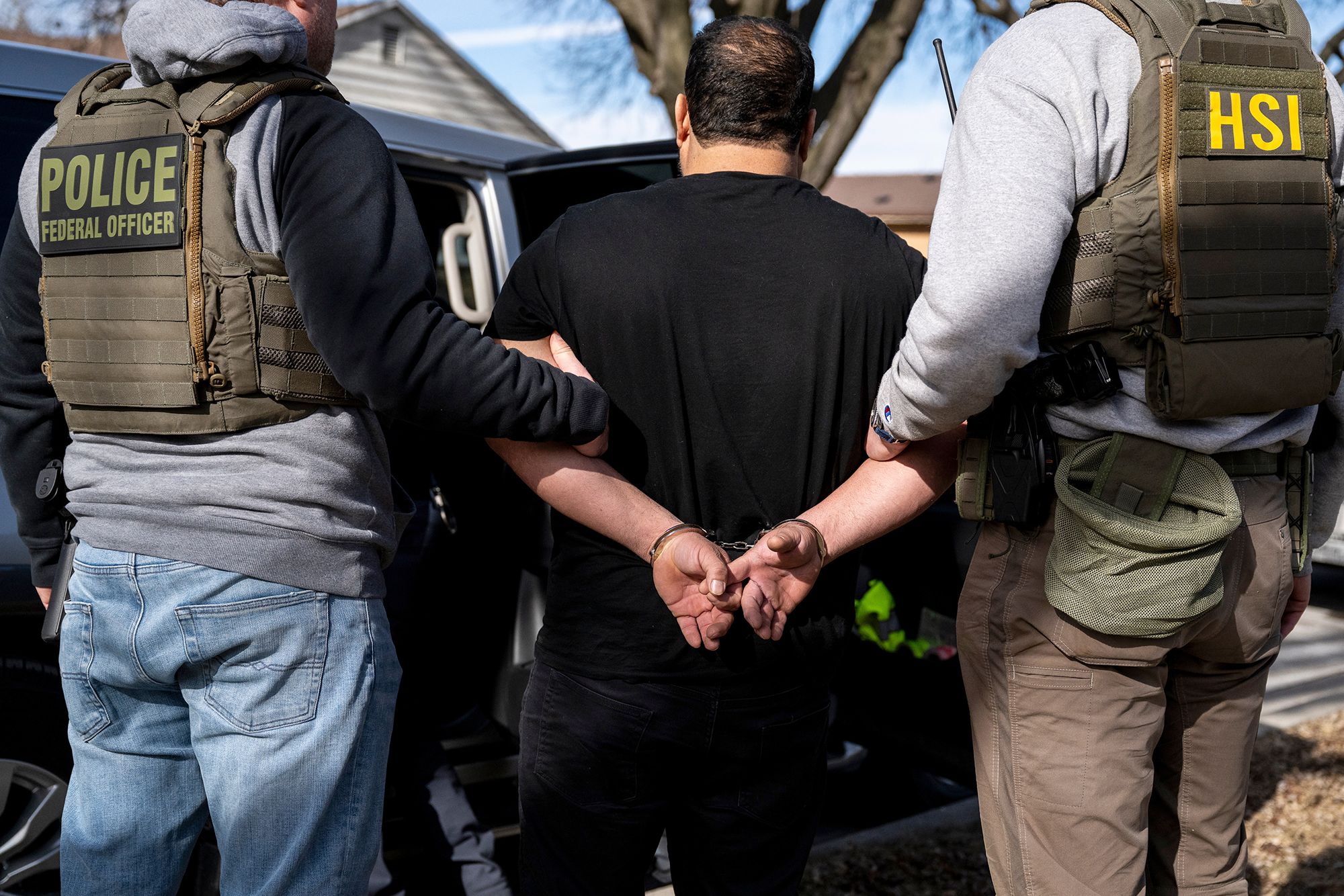 <i>Christopher Dilts/Bloomberg/Getty Images via CNN Newsource</i><br/>US Immigration and Customs Enforcement agents detain a suspect during a multi-agency enforcement operation in Lyons