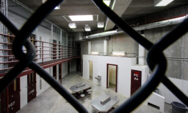 This 2013 photo shows the interior of an unoccupied communal cellblock is seen at the US Naval Base at Guantanamo Bay in Cuba.