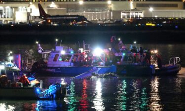 Emergency units work in the Potomac River early Thursday morning.