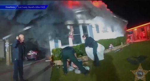 <i>Lee County Sheriff's Office/WSVN via CNN Newsource</i><br/>Body camera footage showcased the deputies’ heroic moments after one woman informed them a disabled and injured man was trapped inside a bedroom.