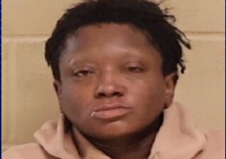 A woman accused of stealing thousands of dollars in merchandise from a local Target over the past 18 months was arrested Saturday after attempting to run from police.