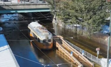 MBTA chief operating officer Ryan Coholan said the tracks suddenly flooded on the Mattapan high speed line around 7:30 a.m. while the train was in the station. It ended up stuck in the rapidly rising water with six passengers and an operator on board. The water rose about two feet up on the side of the trolley.