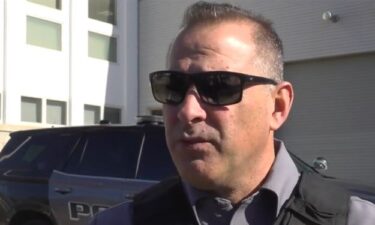 West Long Branch Police Officer David Brosonski is seen trudging through the frigid