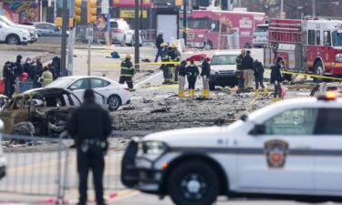 Investigators work the scene after a small plane crashed in Philadelphia