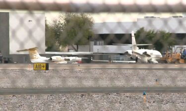 Two planes sit on the runway at Scottsdale Airport after the incident.