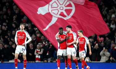 Arsenal players celebrate regaining the lead against Man City.
