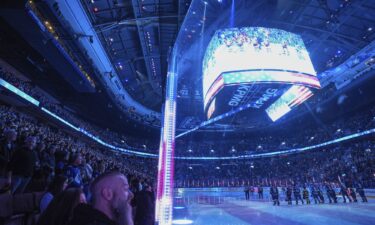 Fans boo as the US national anthem is sung before the Vancouver Canucks and Detroit Red Wings play an NHL hockey game in Vancouver