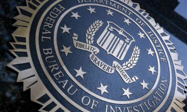 The Department of Justice FBI seal is displayed in Washington