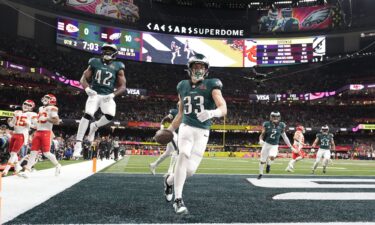 Philadelphia Eagles' Cooper DeJean celebrates after intercepting a pass and running it back for a touchdown during the Super Bowl game against the Kansas City Chiefs.