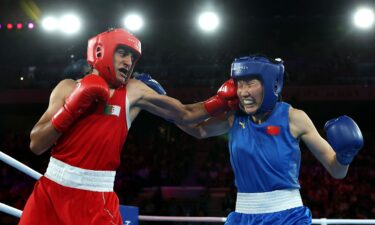 Algeria's Imane Khelif celebrates winning at the Olympics.
