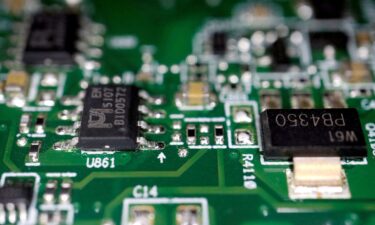 Semiconductor chips are seen on a printed circuit board in this photo illustration taken on February 17