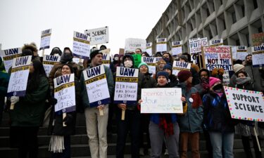 People rally at Health and Human Services headquarters to protest the polices of President Donald Trump and Elon Musk on Wednesday